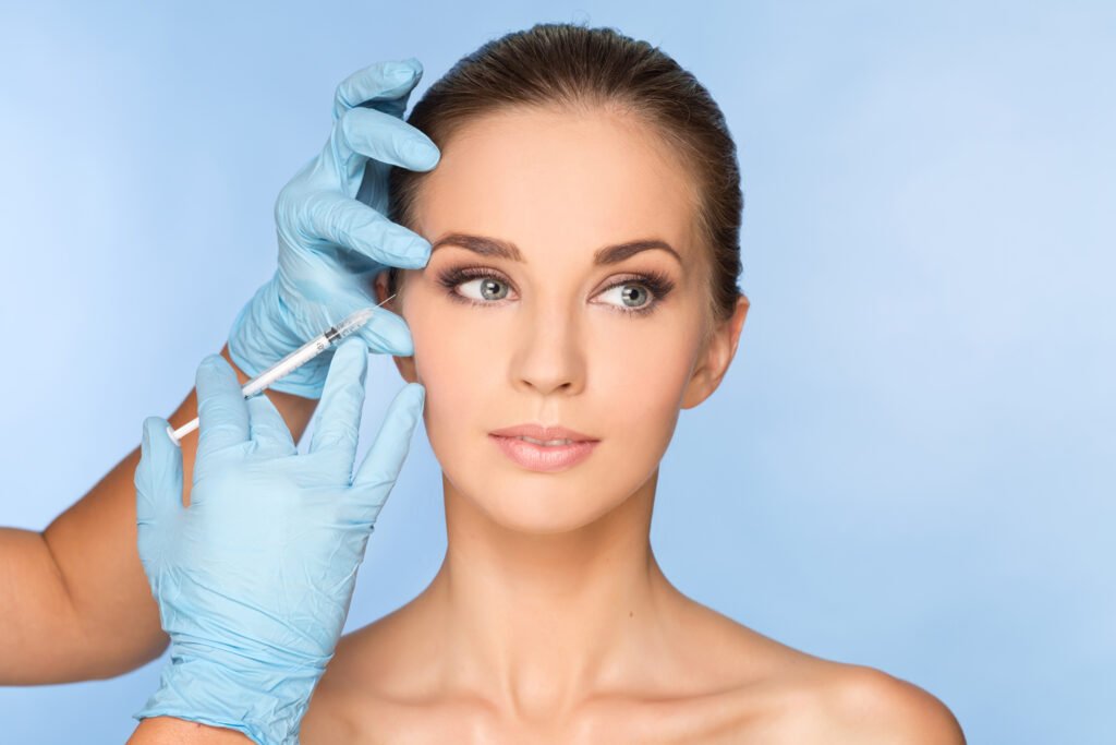 Beauty woman giving botox injections.